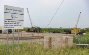 Construction site with large sign.